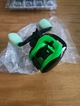 13 Fishing Modus Radioactive Pickle MODRP2-7.3:1 Lh Casting Reel. Fixed Price $50.00.