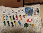 Lot)die-cast Cars, Fortnite Stampers Bag, Finger Skateboards, Spinning Top Toys. Fixed Price $53.00.