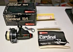 Abu Garcia Cardinal 154 Skirted Spool Spinning Reel Box With Paperwork Wrench. Fixed Price $125.00.