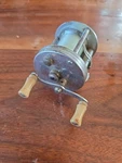 Vintage Pflueger Trump Casting Fishing Reel Trademark No. 1943. Fixed Price $20.00.