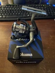 Okuma Azaki 20 Spinning Reel. 4:8:1 Line Retrieve 6.6 Oz Right Or Left. Fixed Price $45.00.