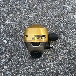Zebco 202K-GWG9 Gold Fishing Reel Precision Die Cast Alloy Gears- New See Desc. Fixed Price $10.00.