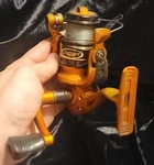 R2F Fishing Reel Bright Orange Spinning. Fixed Price $22.99.