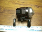 Zebco Heat Brown ?/ Red Plastic Fishing Reel,works But Base Broken. Fixed Price $8.00.
