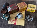 3 Vintage Fishing Reels + Boxes: Zebco Zero Hr Bomb, South Bend 750, Bronson 25C. Fixed Price $39.00.