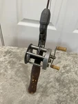 Vintage Pfl Eger Trump Trademark No. 1943 Bait Casting Reel And Steel Rod Combo. Fixed Price $130.00.