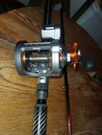 Okuma CW-303D Linecounter Fishing Reel Plus 10'6" Rod. Fixed Price $250.00.