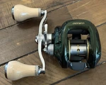 Excellent Condition Shimano Green Curado 201E7 7:1 Fishing Reel W/ 100MM Gomexus. Fixed Price $449.99.